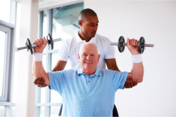 old man doing weight lifting